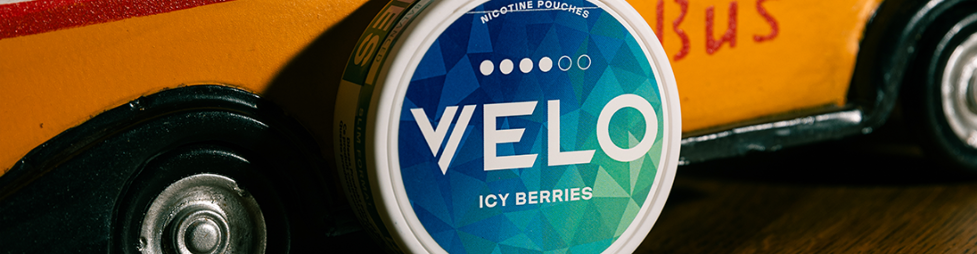 a box of VELO nicotine pouches in the hands of a woman