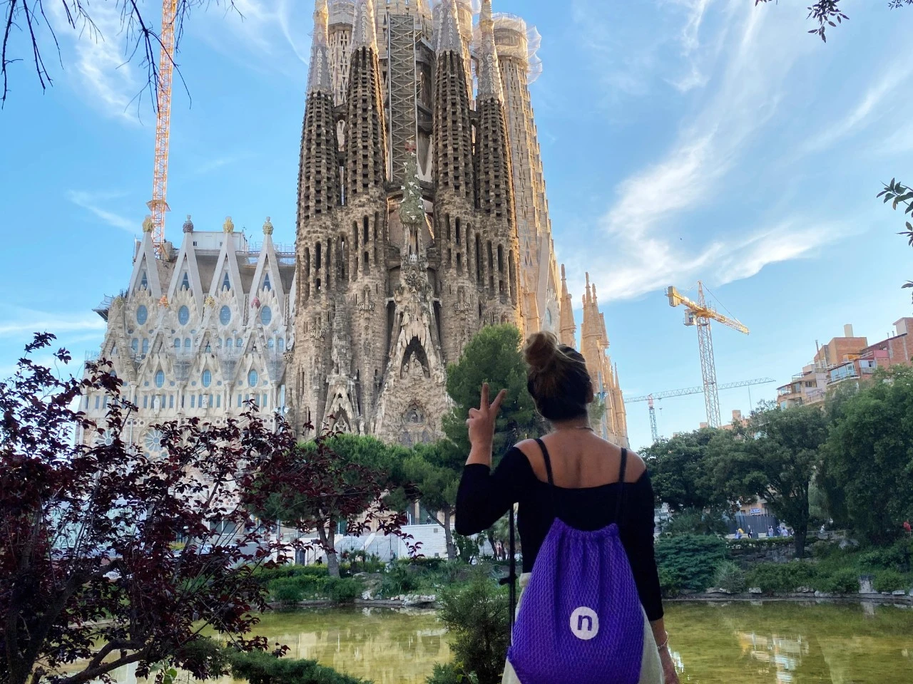 A woman enjoying the views of the Sagrada Familia in Barcelona